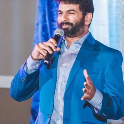 Nick Harinath, founder of NikTech AI, speaking at an event